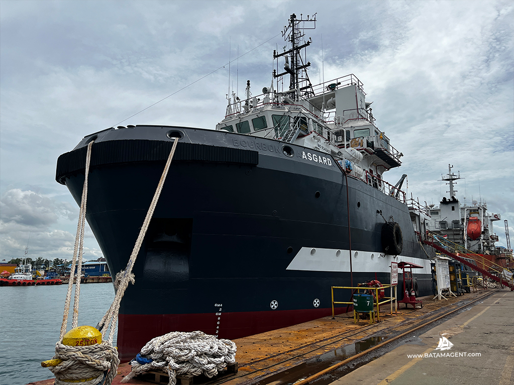 AHTS vessel Asgard moored at the jetty of PaxOcean Shipyard in Batam after completing repair and re-inspection works, awaiting further sailing instructions from the vessel owner, organized by PT. Bisa Jasa Segara (Batam Shipping Agency), a ship agency company based in Batam, Indonesia.