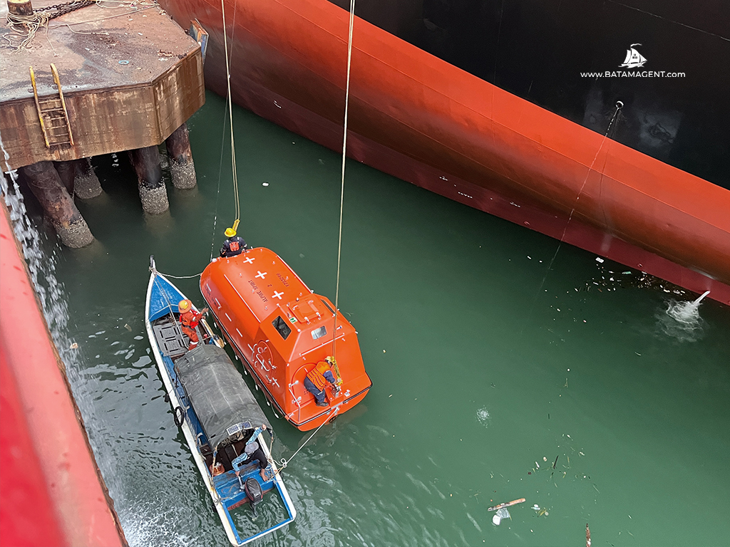 Lifeboat and rescue boat activity for MT Alpine Spirit during docking support in Batam. All formalities and permits are arranged by Batam Shipping Agency.