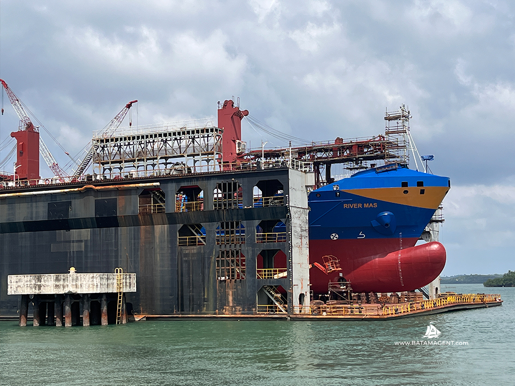 MV. River Mas in the floating dock after hull repainting at PaxOcean Batam.